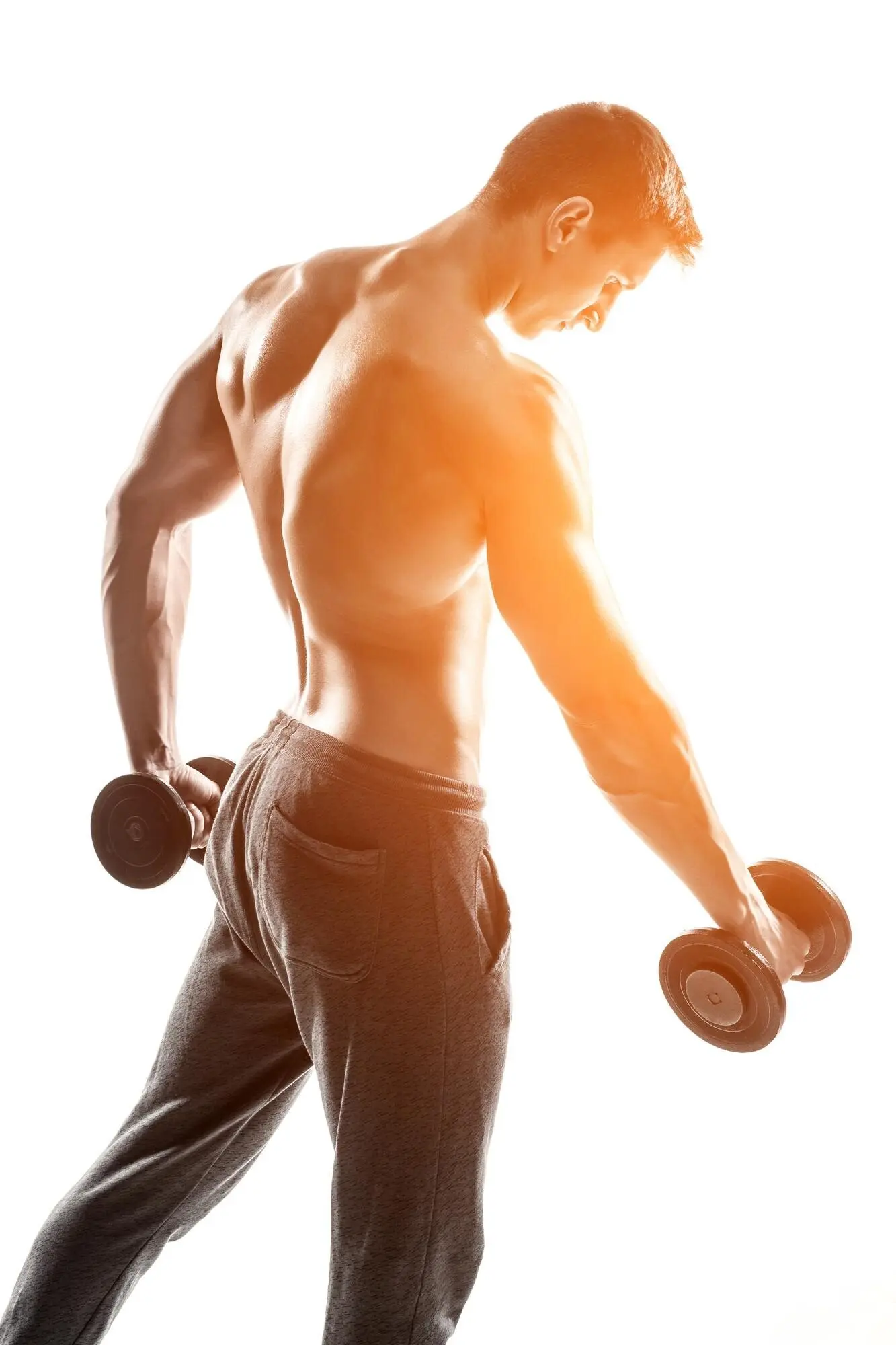 A handsome, muscular man working out with dumbbells, isolated on a white background with a solar flare.